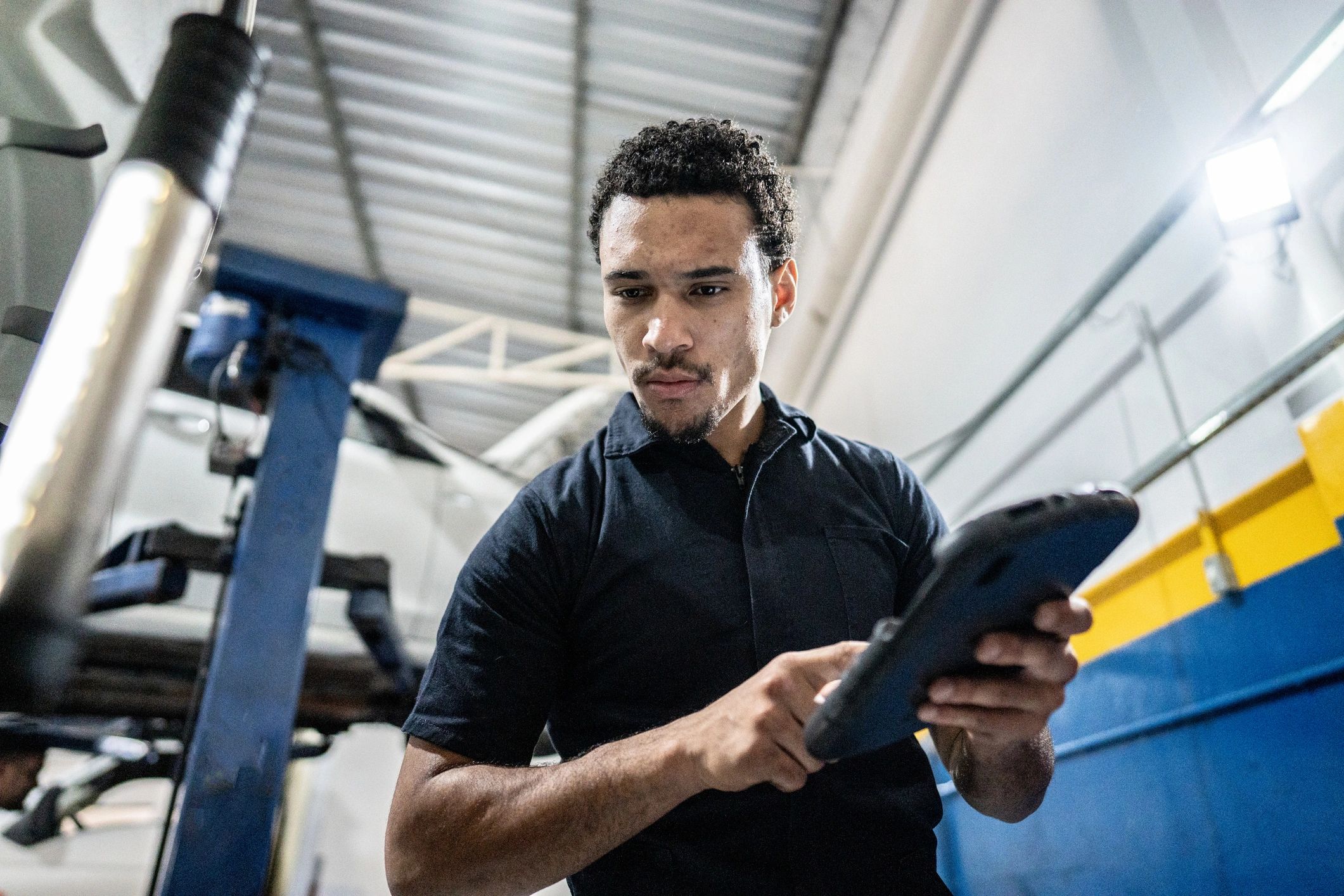 Field technician using a rugged tablet