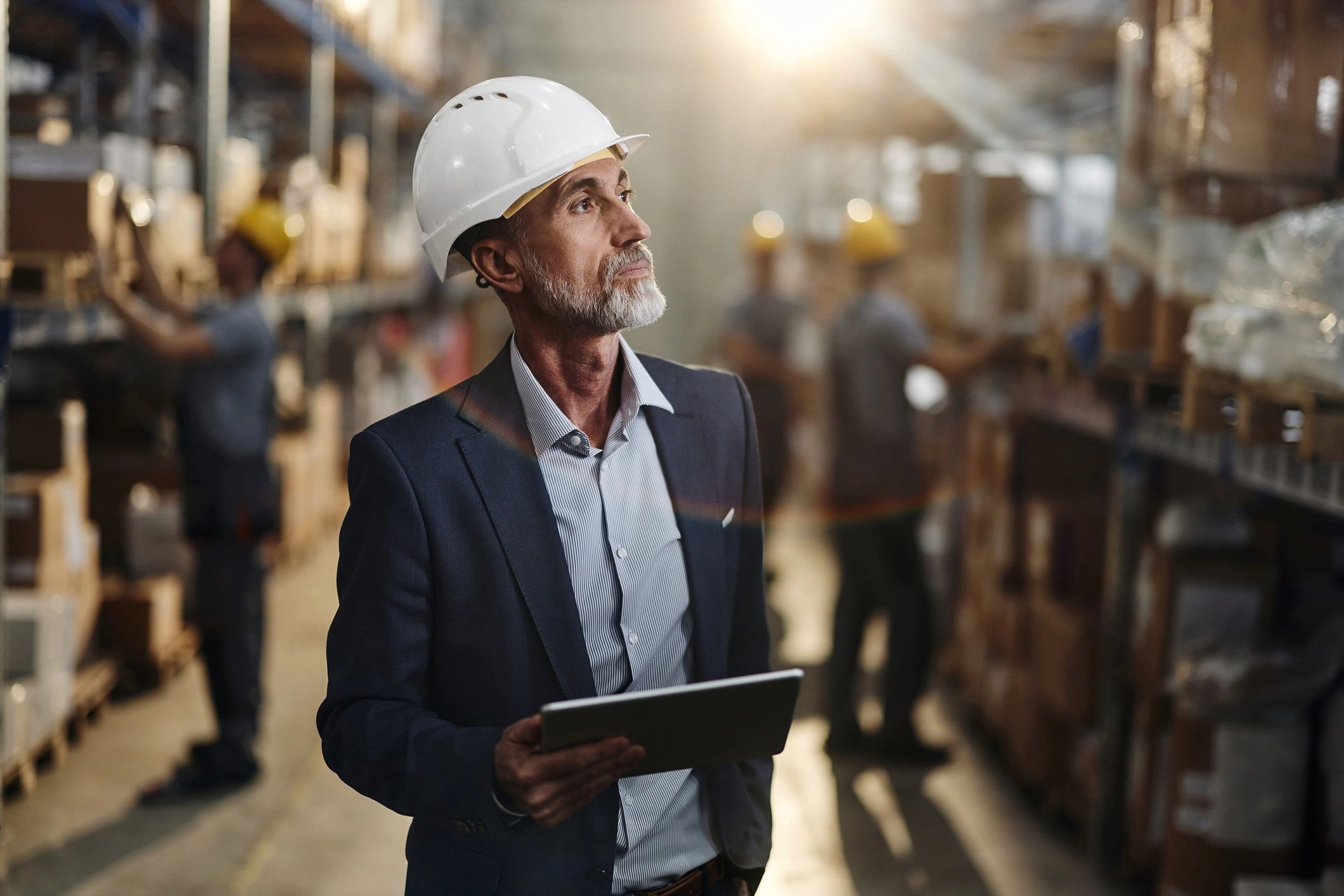 Operations professional using a tablet in an industrial facility