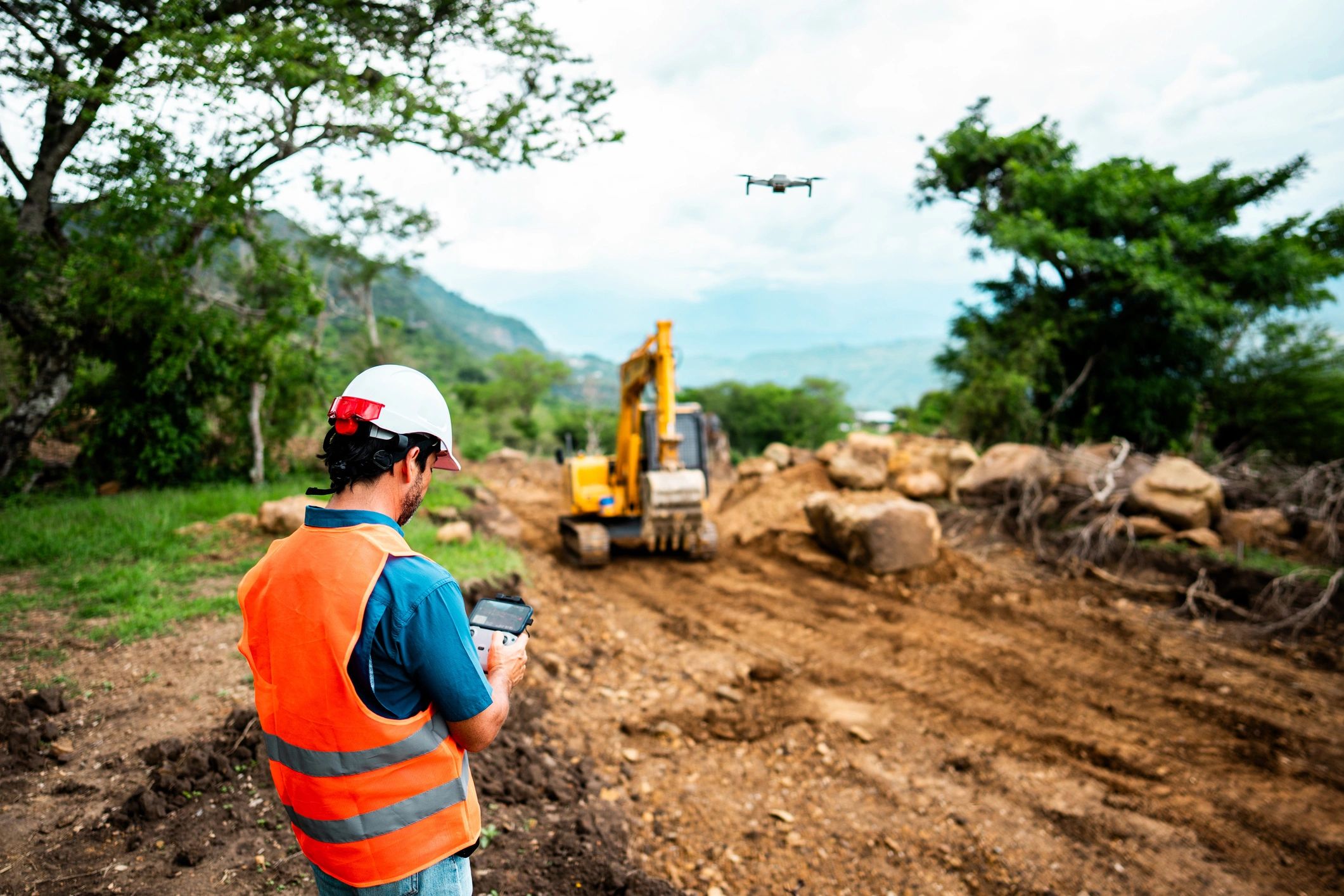 Field technician using rugged technology at an industrial work site