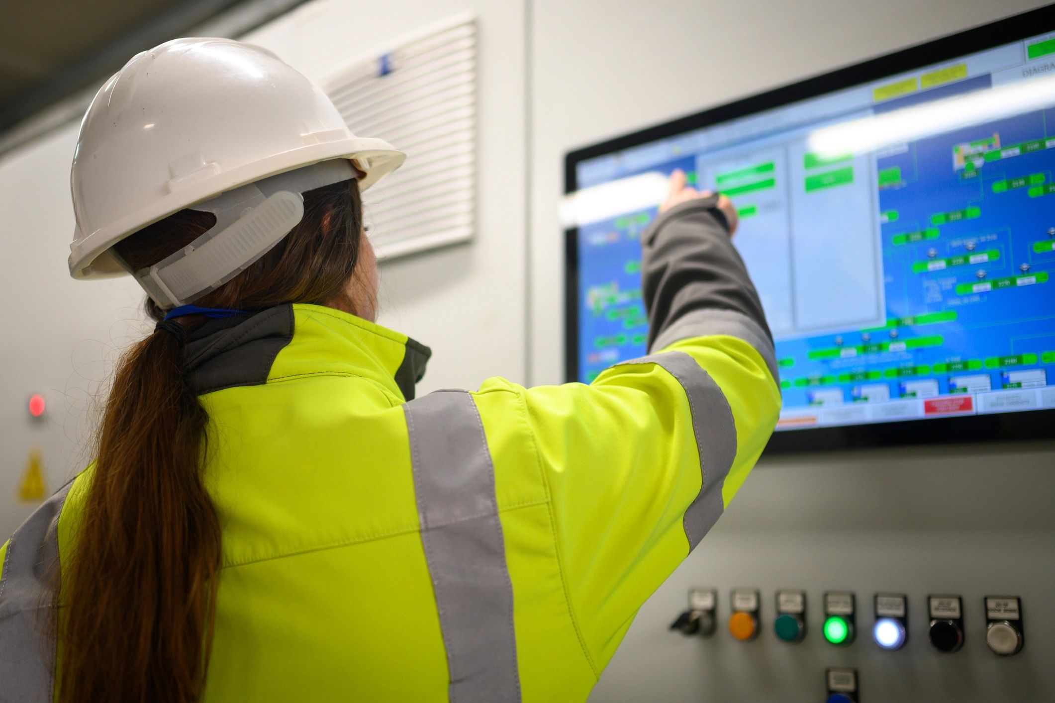 Operator working at an industrial control interface